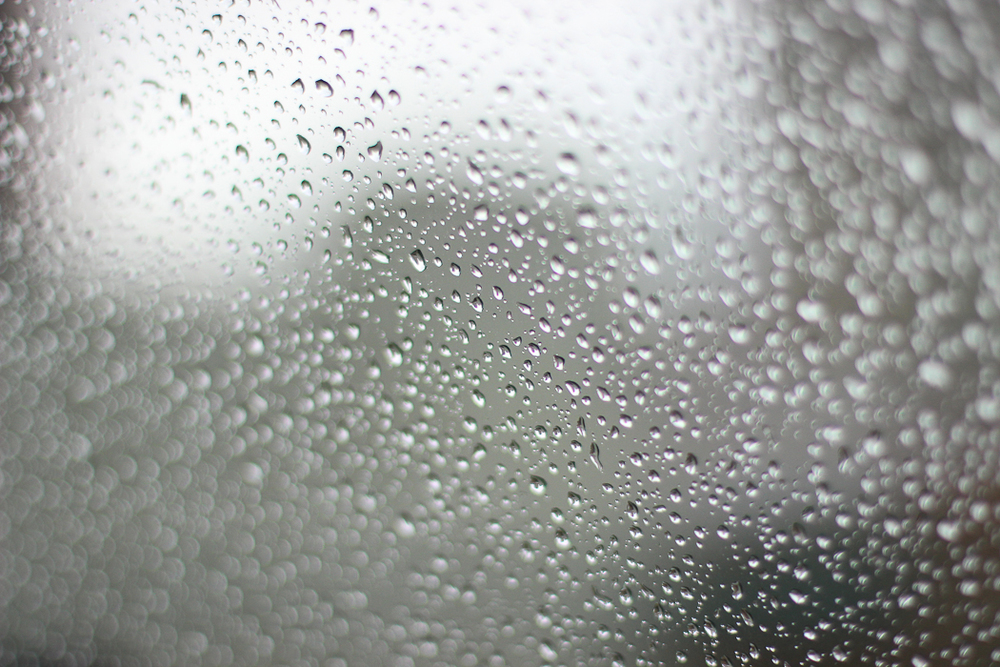 Raindrops through car window