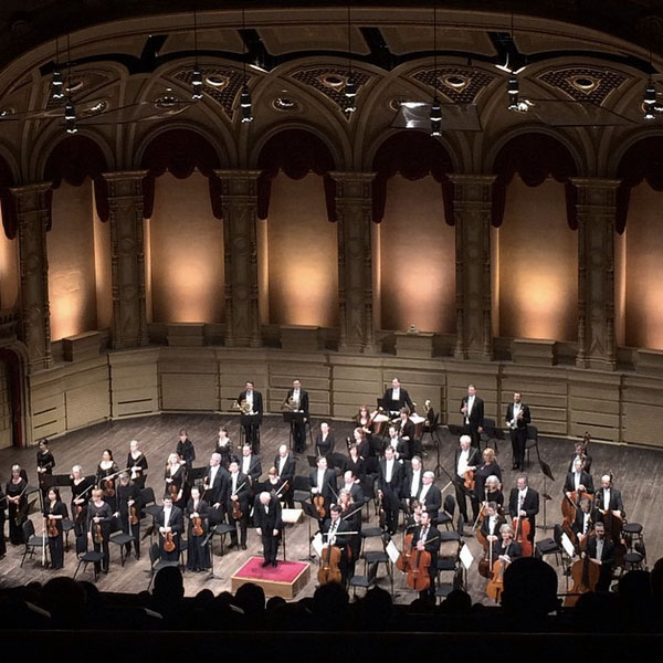 Vancouver Symphony Orchestra and conductor Bramwell Tovey taking a bow