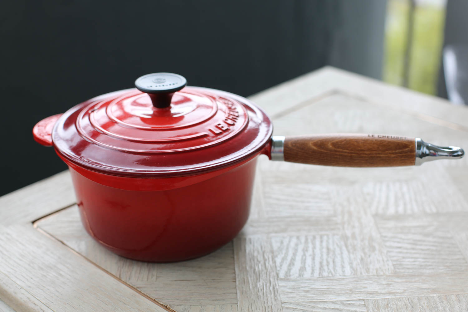 Le Creuset Heritage Wooden Handle Cast-Iron Saucepan. The wooden handle makes it comfortable to hold and keeps it cool to the touch. Perfect for stove-top cooking. I bought mine at Williams-Sonoma. 