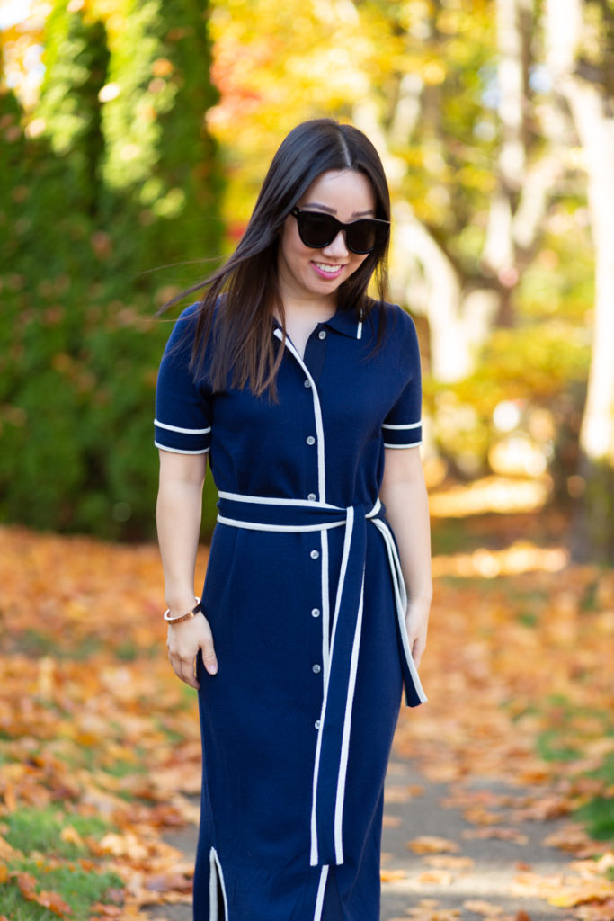 Asian girl wearing navy sweater dress with sunglasses