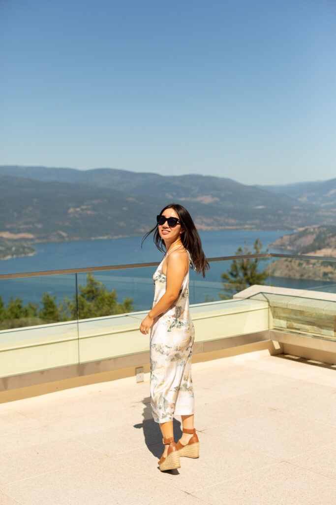 Photo taken at Sparking Hill with a view of the lake. Wearing satin halter midi dress from Aritzia and Marc Fisher platform espadrilles.
