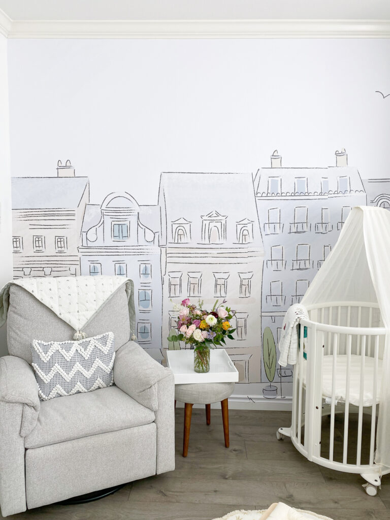 Parisian theme wallpaper in baby girl nursery