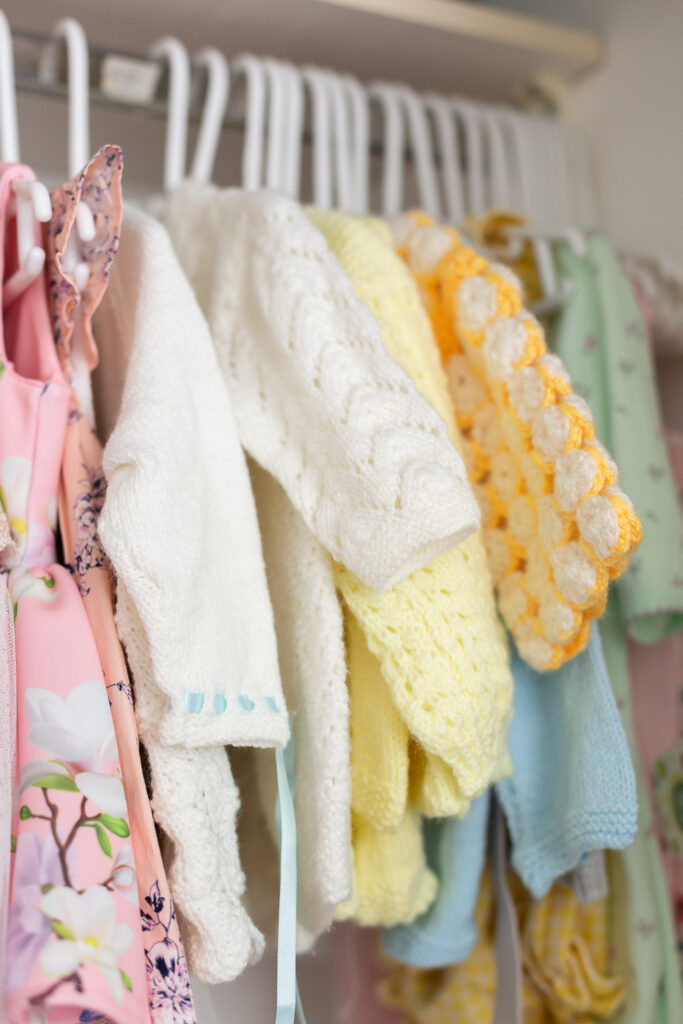 Baby girl closet with crocheted sweaters